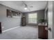 Bedroom featuring neutral walls, carpet, and a window for natural light at 20319 Starfinder Way, Tampa, FL 33647