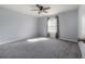 Bright bedroom with carpet, fan and natural light. This is a calm and neutral room at 20319 Starfinder Way, Tampa, FL 33647