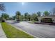 Welcoming community entrance with a landscaped median, a decorative sign, and well-maintained curb appeal at 20319 Starfinder Way, Tampa, FL 33647