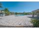 Expansive community pool area with lounge chairs, umbrellas, and lush landscaping, offering a resort-like experience at 20319 Starfinder Way, Tampa, FL 33647
