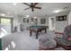 Spacious game room with a pool table, carpet, and staircase access, ideal for leisure and fun at 20319 Starfinder Way, Tampa, FL 33647