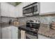 Modern kitchen with stainless steel appliances, sleek countertops, and stylish cabinetry providing a functional cooking space at 20319 Starfinder Way, Tampa, FL 33647