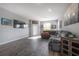 Spacious living room boasts recessed lighting, wood-look floors and a comfortable sectional sofa at 20319 Starfinder Way, Tampa, FL 33647