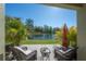 Outdoor patio featuring comfortable seating and a view of the scenic pond at 20319 Starfinder Way, Tampa, FL 33647