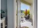 An outdoor patio overlooking a tranquil lake, palm trees and comfy lounge seating at 20319 Starfinder Way, Tampa, FL 33647