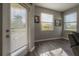 Bright sun room with wood-look floors and lots of natural light at 20319 Starfinder Way, Tampa, FL 33647