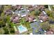 Aerial view of a condo community featuring lush landscaping, a swimming pool, and convenient parking areas at 2260 Oak Neck Rd # B, Clearwater, FL 33763