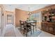 Dining room showcases a wooden table, hutch, and natural light from the window at 2260 Oak Neck Rd # B, Clearwater, FL 33763