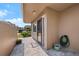 Inviting front entrance featuring stone pavers, a secure screen door, and convenient carport view at 2260 Oak Neck Rd # B, Clearwater, FL 33763