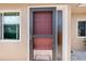 Close-up of a charming front door with adjacent sidelight and window providing natural light at 2260 Oak Neck Rd # B, Clearwater, FL 33763