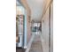 Bright hallway leading to the living area, showcasing neutral paint and tile flooring at 2260 Oak Neck Rd # B, Clearwater, FL 33763