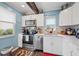 Charming kitchen with white cabinets, stainless steel appliances, and natural light from the window at 2260 Oak Neck Rd # B, Clearwater, FL 33763