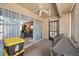 Enclosed patio looking into the living room, featuring neutral-colored walls and flooring, and a ceiling fan at 2260 Oak Neck Rd # B, Clearwater, FL 33763