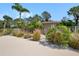 Poolside area showcasing a clean restroom, lush landscaping, and a serene setting for relaxation and enjoyment at 2260 Oak Neck Rd # B, Clearwater, FL 33763