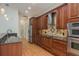 Kitchen featuring stainless steel appliances, wood cabinets, and granite counters at 2270 Barbara Dr, Clearwater, FL 33764