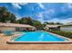 Refreshing community pool surrounded by lounge chairs, perfect for relaxation and socializing at 2448 Enterprise Rd # 5, Clearwater, FL 33763