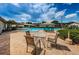 Inviting community pool area with comfortable seating and lush landscaping for a relaxing retreat at 2448 Enterprise Rd # 5, Clearwater, FL 33763