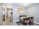 Cozy dining area adjacent to the kitchen featuring a pass-through window and neutral decor at 2448 Enterprise Rd # 5, Clearwater, FL 33763