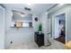Dining area with a serving hatch to living room, providing easy access and ample light at 2448 Enterprise Rd # 5, Clearwater, FL 33763