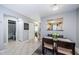 Neutral dining area leading to the bathroom and bedroom with a view of the kitchen at 2448 Enterprise Rd # 5, Clearwater, FL 33763