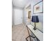 Entryway with tile flooring, view to kitchen, and stylish decor at 2448 Enterprise Rd # 5, Clearwater, FL 33763
