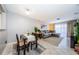 Bright living room featuring a gray sofa, area rug, and sliding glass doors for natural light at 2448 Enterprise Rd # 5, Clearwater, FL 33763