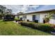 Inviting patio area, perfect for outdoor relaxation with seating, lush plants, and sliding door access at 2448 Enterprise Rd # 5, Clearwater, FL 33763