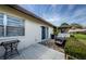 The paved patio features a grill, furniture, garden, and screened in area at 2448 Enterprise Rd # 5, Clearwater, FL 33763