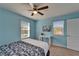 Cozy bedroom features two windows offering natural light and ceiling fan at 3019 Old Fulton Pl, Brandon, FL 33510