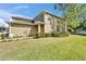 Attractive townhome with a green lawn, showcasing the exterior features and design at 3019 Old Fulton Pl, Brandon, FL 33510