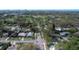 An aerial view of a neighborhood with lush trees and manicured lawns and a red pin showing the home's location at 325 Orangeview Ave, Clearwater, FL 33755