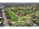 Scenic aerial view of a golf course with a view of the neighborhood at 325 Orangeview Ave, Clearwater, FL 33755