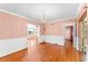 Elegant dining space with hardwood floors, chandelier, and multiple entryways at 325 Orangeview Ave, Clearwater, FL 33755