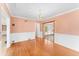 Dining area featuring hardwood floors, wainscoting, and a decorative chandelier at 325 Orangeview Ave, Clearwater, FL 33755