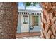 Charming entrance with a striped awning at 325 Orangeview Ave, Clearwater, FL 33755