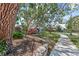 Home showcasing a beautiful yard with mature trees and plants, creating a serene landscape at 325 Orangeview Ave, Clearwater, FL 33755