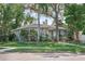 Charming single-story home with lush landscaping, a welcoming front porch, and a classic architectural design at 325 Orangeview Ave, Clearwater, FL 33755
