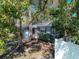 Charming single story home showcasing mature trees, bushes and shrubbery in a well maintained lawn at 325 Orangeview Ave, Clearwater, FL 33755