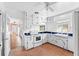 Retro kitchen featuring white cabinetry, colorful tiling, and vintage appliances at 325 Orangeview Ave, Clearwater, FL 33755