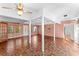 Spacious living room with mosaic tile flooring, natural lighting, and exposed ceiling beams at 325 Orangeview Ave, Clearwater, FL 33755