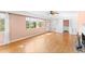 Spacious living room with natural light, hardwood floors, and built-in shelving at 325 Orangeview Ave, Clearwater, FL 33755