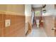 This bathroom features peach tile, a shower-tub, toilet, speckled floors, and built-in shelving at 3403 Pearson Rd, Valrico, FL 33596