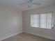 Clean bedroom with neutral walls, tiled floor, a ceiling fan and window with natural light at 373 S Mcmullen Booth Rd # 92, Clearwater, FL 33759