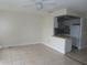 Open living room with tile flooring connected to the kitchen, ready for your personal touch at 373 S Mcmullen Booth Rd # 92, Clearwater, FL 33759