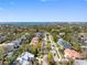 A lush neighborhood street featuring a view of the ocean in the background with beautiful blue skies overhead at 404 S Barbara Ln, Tampa, FL 33609