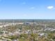 Panoramic aerial showcasing a city skyline, roads, and homes nestled under lush trees within a large city landscape at 404 S Barbara Ln, Tampa, FL 33609