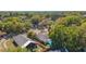 Stunning aerial view of the home and backyard oasis with screened-in pool at 408 Valencia Park Dr, Seffner, FL 33584