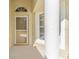 Close up of the front porch with decorative window and door at 408 Valencia Park Dr, Seffner, FL 33584