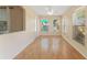 Inviting living room with natural light from large windows, neutral colors, and laminate flooring at 408 Valencia Park Dr, Seffner, FL 33584
