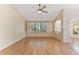 Bright living room featuring laminate floors, neutral paint, and large window at 408 Valencia Park Dr, Seffner, FL 33584